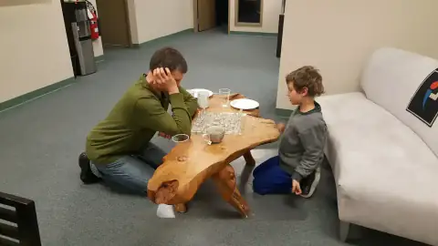 Guests chatting and enjoying refreshments in a decorated lounge
