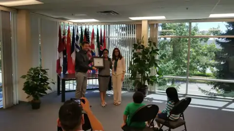 Graduate smiling with certificate after the ceremony