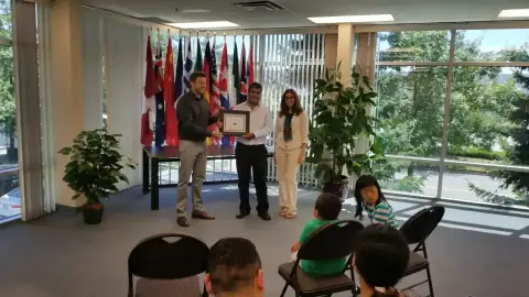 START Canada graduate receiving recognition in front of peers