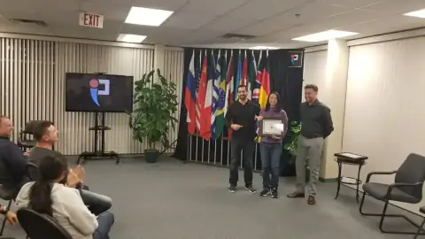 Graduate receiving a certificate during a ceremony
