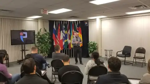 Graduate holding certificate with instructor during celebration