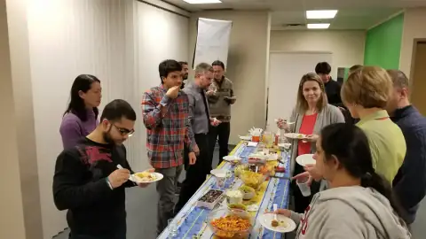 Panelists and attendees engaging in conversation in a classroom